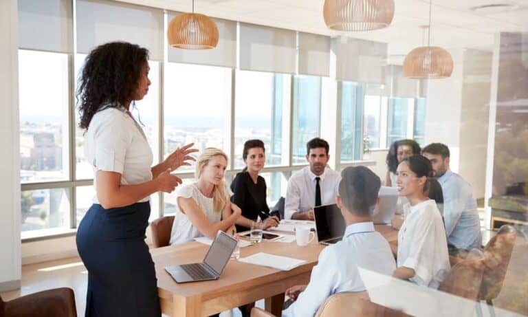 Photo of an employer leading a work meeting.