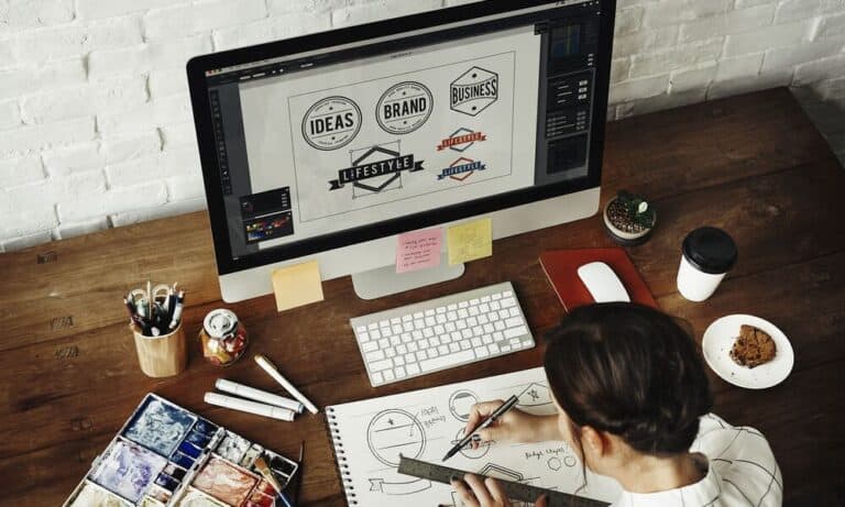 Photo of a Graphic Designer working from home.