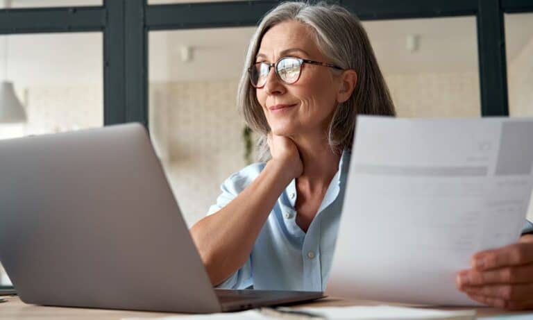 Photo of a Hiring Manager looking over a resume.