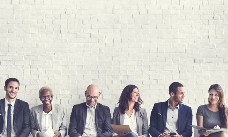 Photo of hiring managers smiling.