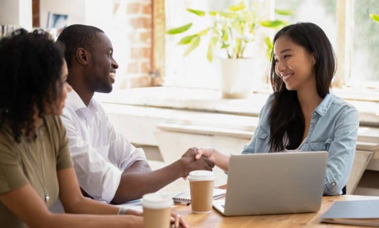Photo of employee shaking an employers hand.