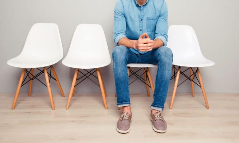 Man sitting on chair in waiting room