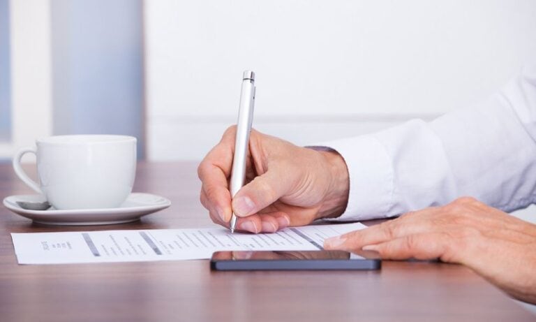 Man updating his CV/resume