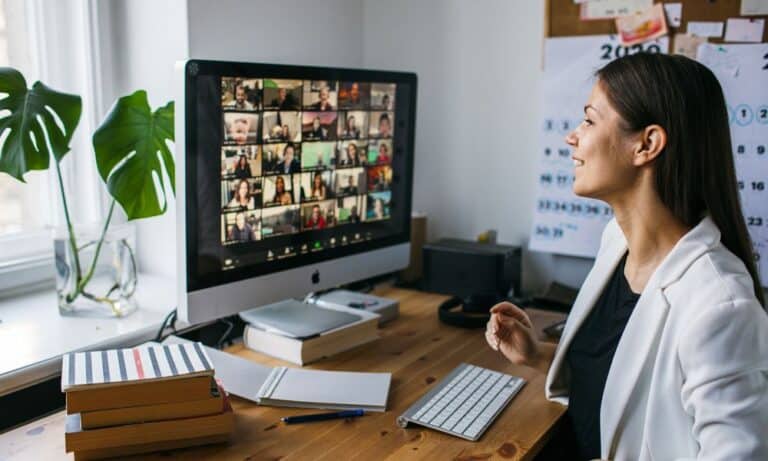 Photo of an employer managing a team virtually.