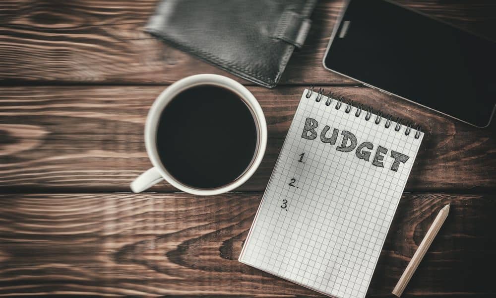 Phtoto of managing budget with a cup of coffee.