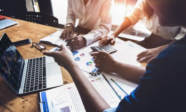 Photo of Data Driven employees working together.