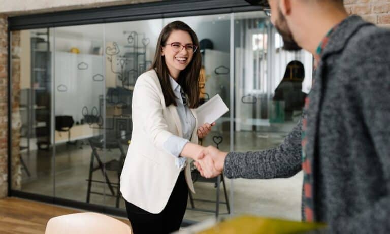 Woman shaking hands with a recruiter