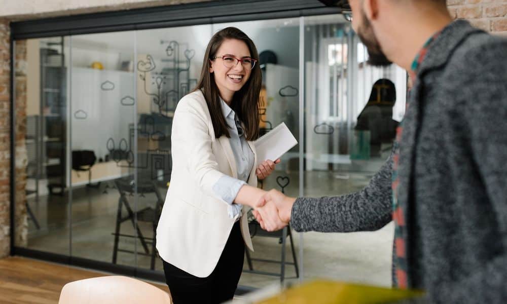 Woman shaking hands with a recruiter