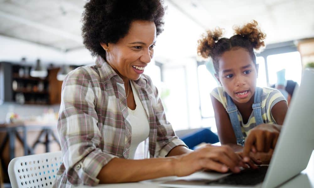 Photo of a working mom working from home.