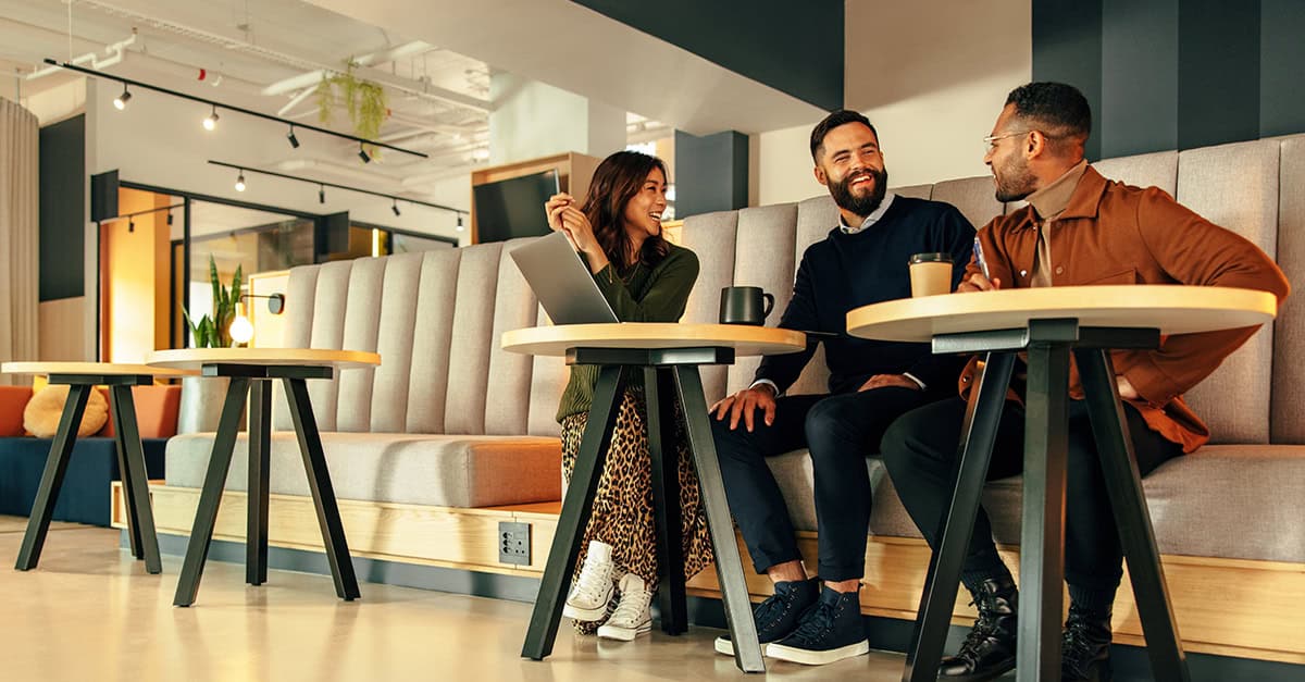 Coworkers collaborating at a cafe