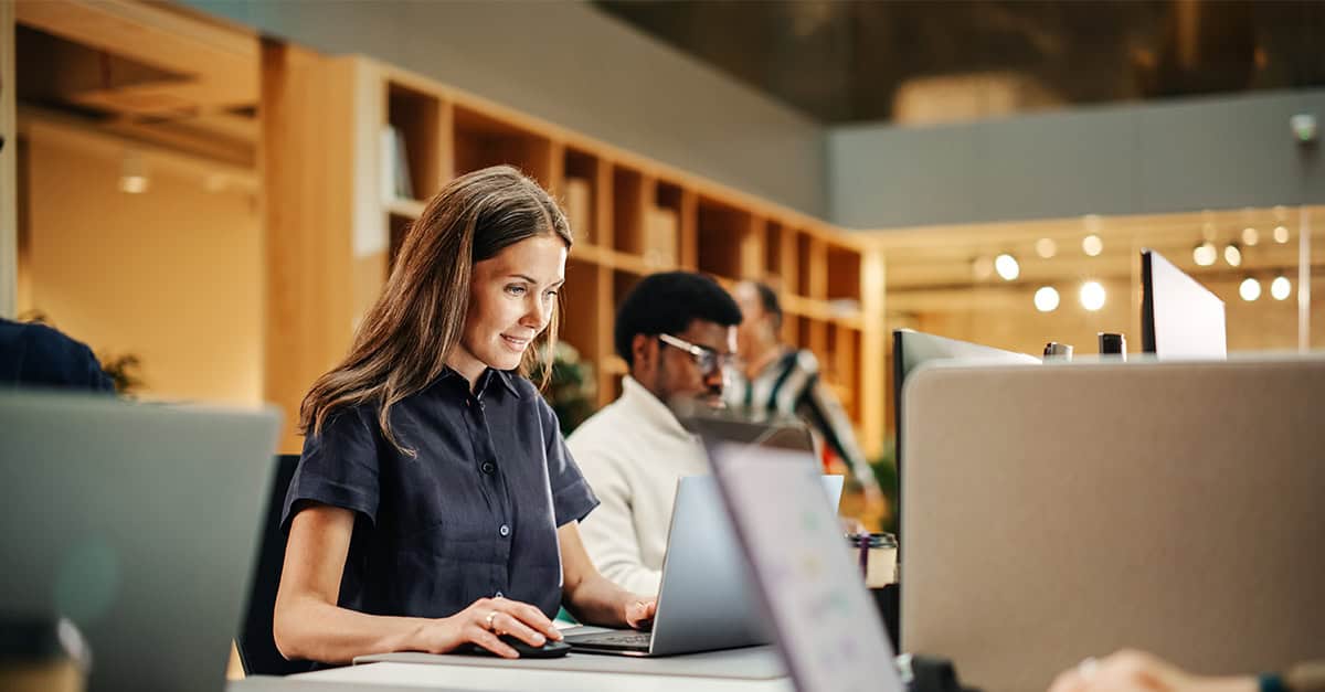 Coworking space with diverse group of people working at desks