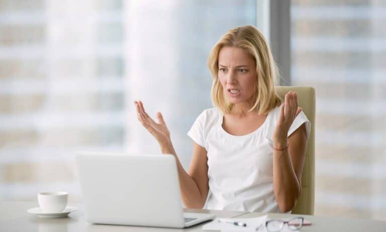 Woman frustrated at desk