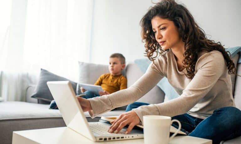 Working mom on laptop at home