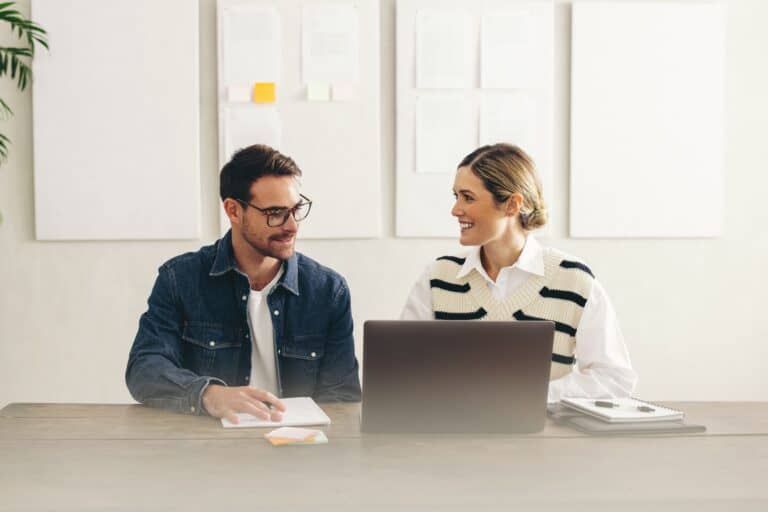 Photo of a man and women working together.