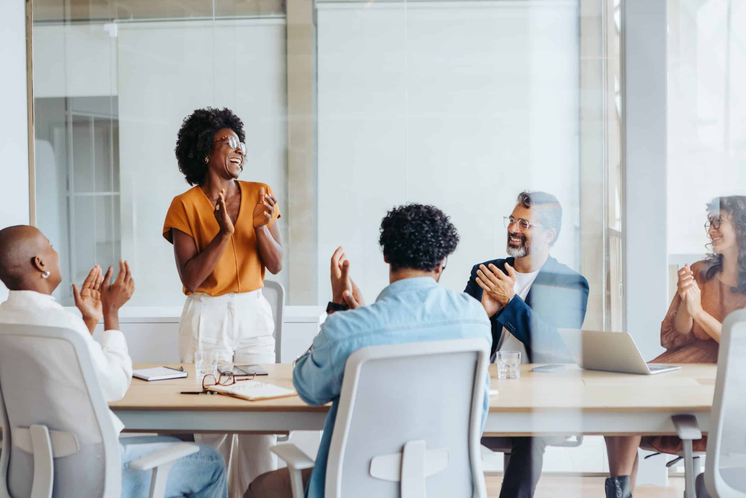 Photo of a team having a successful team meeting.