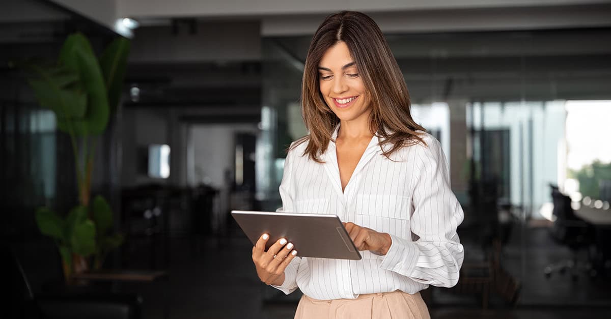 Smiling woman working on a tablet