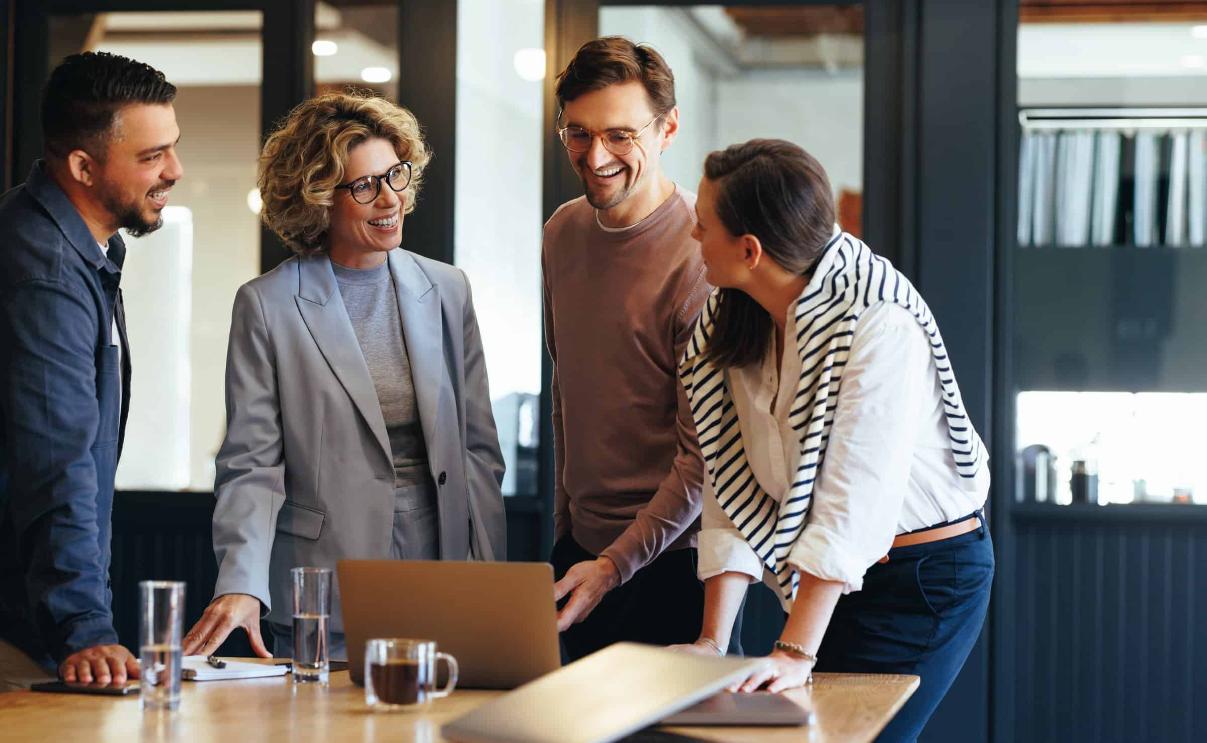 Photo of a team working together in an office space.