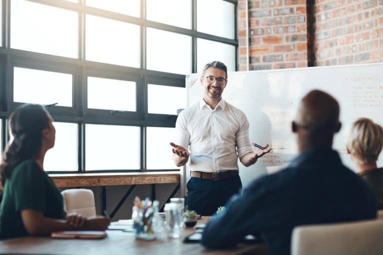 Business leader presenting a talent planning strategy to a diverse team.