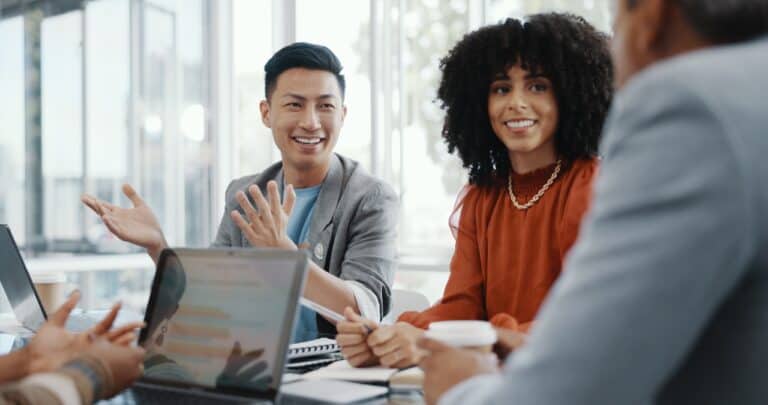 Colleagues discussing strategic AI talent sourcing solutions